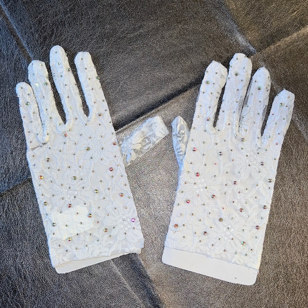Madonna 80s inspired fashion - white lace embellished gloves.